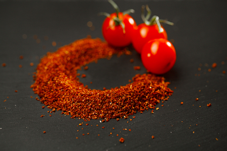 Natural ground sun dried tomatoes powder have a very particular flavour, both sweet and savouryの写真素材