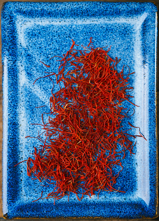 saffron space threads in blue plateの写真素材