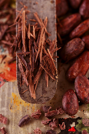 shredded chocolate and cocoa beans  on vintage painted backgroundの写真素材
