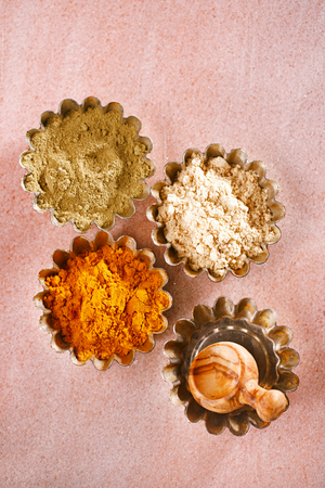 Jalapeno Green Chilli , Ginger and turmeric powder very fine and aromatic on pink marbleの写真素材