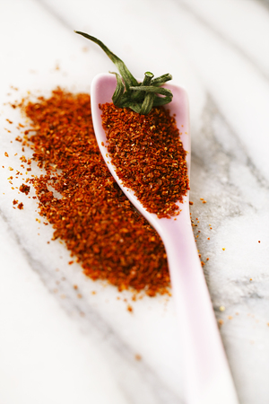 Natural ground sun dried tomatoes powder have a very particular flavour, both sweet and savouryの写真素材