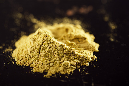 Jalapeno Green Chilli Powder on dark backgroundの写真素材