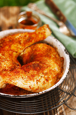 chicken legs spiced by special spice blendの写真素材