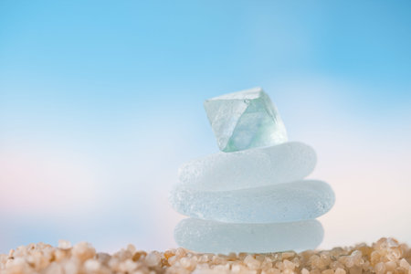 sea glass tower on  beach sand  with seascape background