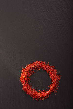 Aleppo Pepper mild chilli flakes in silver plateの写真素材