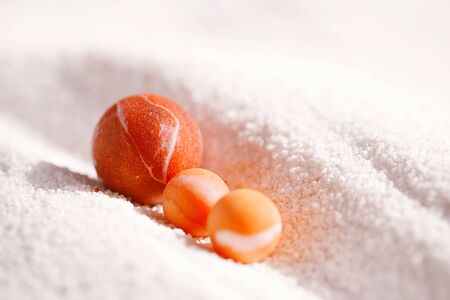 sea glass marbles  with white sand beachの写真素材