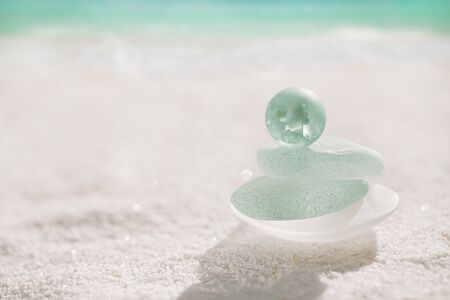 blue sea glass and marble with white sand beachの写真素材
