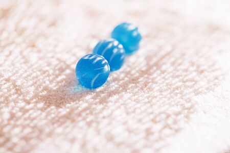 sea glass marbles  with white sand beach  seascapeの写真素材