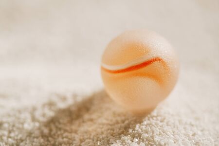 sea glass marbles  with white sand beach  seascapeの写真素材