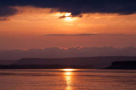 Gloomy sunset on the big river. Lena river. Yakutia. Russia.の写真素材