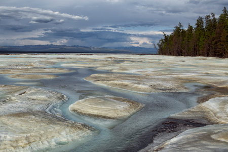 Water flows on the surface of the ice field. Big Moma frost. Yakutia. Russia.の写真素材