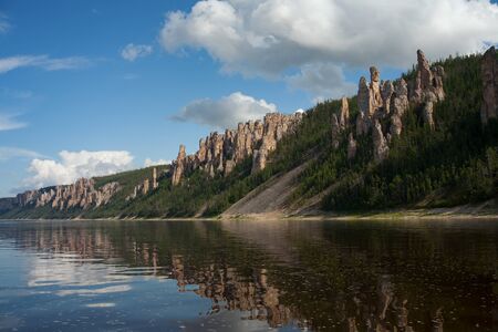 The rocky river bank with the pillars. Lena river. Yakutia. Russia.の写真素材