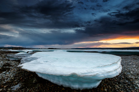 Ice formation on the river. Cloudy and sunset time. Moma River. Yakutia. Russia.の写真素材