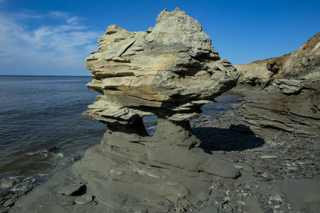 The coastal landscape has been formed by the sea surf. The Laptev Sea. The island of Bolshoi Begichev. Russia.の写真素材