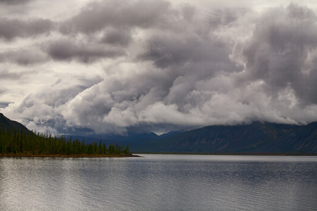 Cloudy sky above mountain lake. Lake Labynkyr In Yakutia.の写真素材