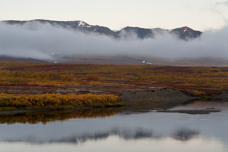 The river and the cloud at the foot of the mountains. Polar Urals. The Republic Of Komi. Russia.の写真素材
