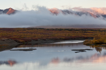 The river and the cloud at the foot of the mountains. Polar Urals. The Republic Of Komi. Russia.の写真素材