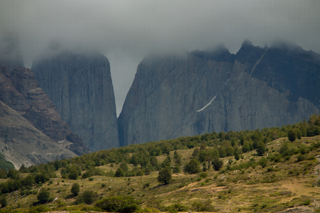 Towers Torres in the clouds. National Park Torres del Paine. Patagonia. Chile.の写真素材