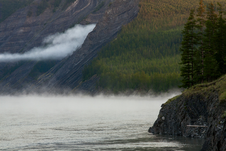 The mist along the rocky shores of the river. The Indigirka river, Sakha Republic, Russia.の写真素材