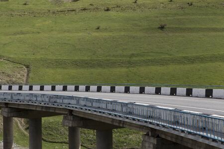 Bridge in the mountains of North Ossetia. The Caucasus. Russia.の写真素材
