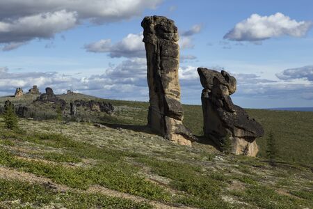 Detached granite rocks of unusual shape on the dais. Ridge Ulakhan-Sis. Yakutia. Russia.の写真素材