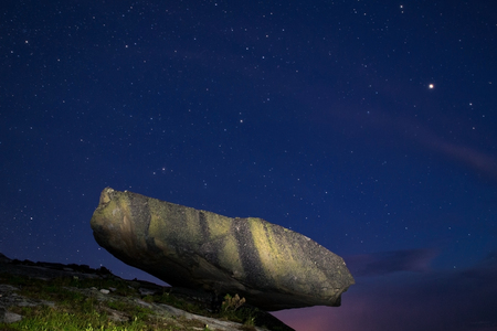 A large boulder on the edge of the abyss. Western Sayan. Natural Park Ergaki. Krasnoyarsk region. Russia.の写真素材