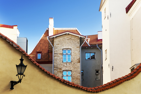 Medieval houses and roofs with a red tile in the old city of Tallinn.の写真素材
