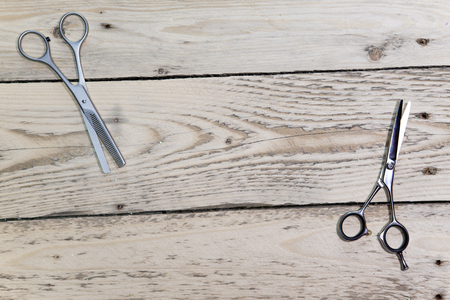scissors for the hairdresser  lie on a wooden boardの写真素材
