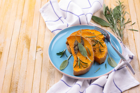 Baked pumpkin with herbs and spicesの写真素材