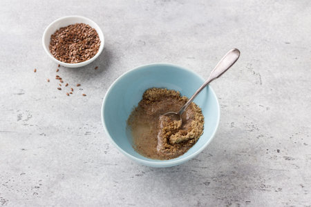 Cooking vegan flaxseed egg on gray textured background, top viewの写真素材