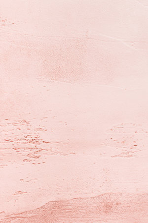 Delicate peach stone background with light base, darker in recesses, painted wall, abstract texture for graphic design or wallpaper, top viewの写真素材