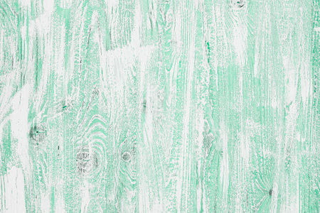 Light green mint wooden background in a cool tone. Wood texture with vertical stripes and knots for wallpaper, graphic design, creativity. Top view, horizontal orientationの写真素材