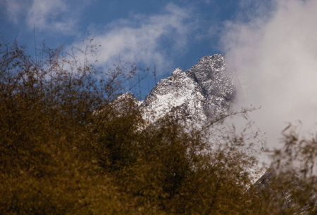 Himalaya cliff peal in fog. View of himalayan peaks in fog from Annapurna Trek - Nepal