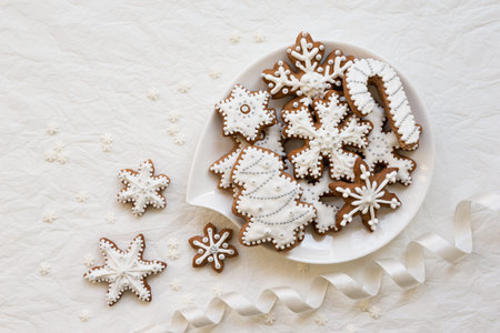 Christmas dekoration with cookies in the shape of snowflakes and stars on a white background