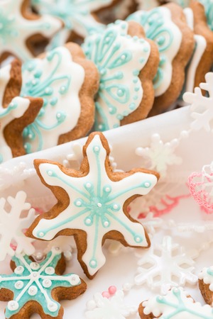 Christmas decoration with cookies in the shape of snowflakes and stars on a white backgroundの写真素材