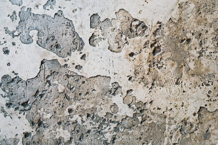 Texture of the old concrete floor in the underpass. This is an old cement floor in spots and cracks...