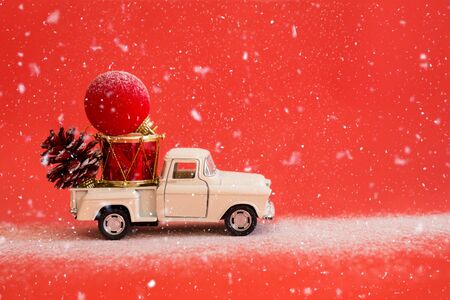 Christmas card with New Year's retro toys on a red background. Minimalism concept, 60s style. Happy holidaysの写真素材