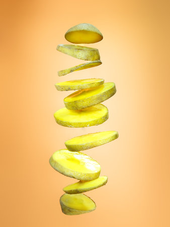 Slices of potato floating on orange background