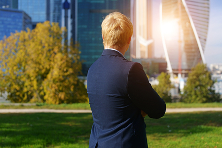 man in jacket looking at business centerの写真素材