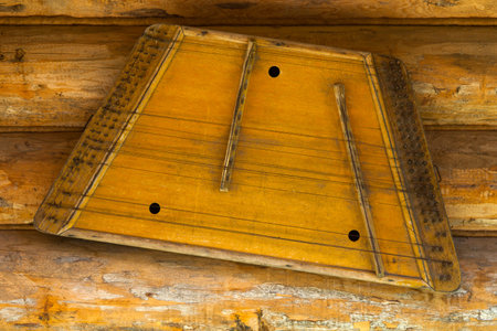 old gusli hanging on the wallの写真素材