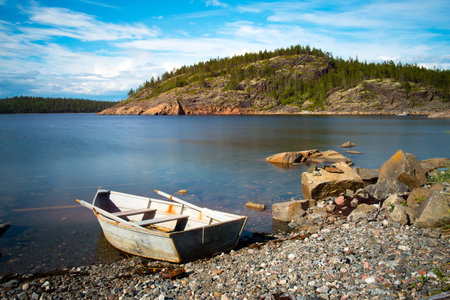Boat on the beach in the morningの写真素材