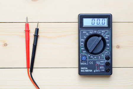multimeter lies on a wooden board
