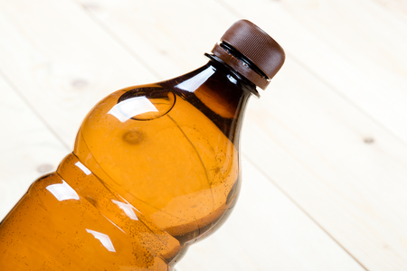plastic bottle on the background of the boardの写真素材