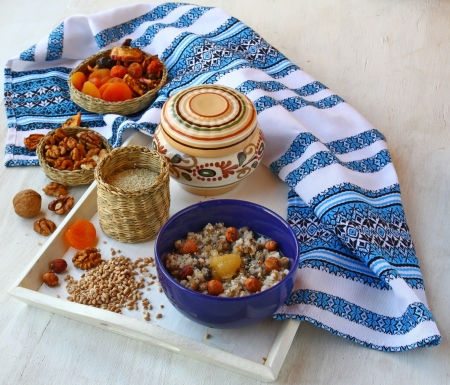 Small basket with wheat porridge which is cooking on Christmas Eve Kutya is a traditional food on Christmas Eve の写真素材