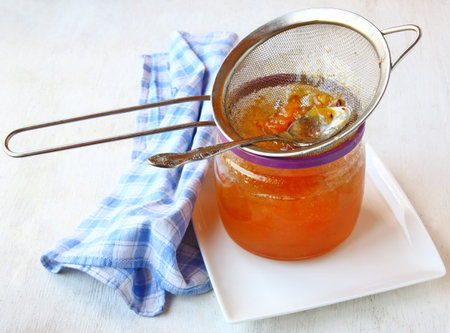 Sieve through which filtered quince jam a homogeneous of density