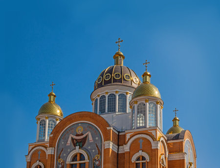 Golden domes of the Holy Virgin Protection Church in Kiev Obolon