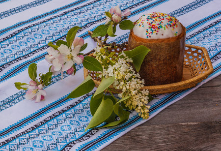Easter cake and apple blossom branch on the table