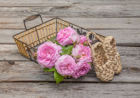 Bouquet of wild rose in vintage style on a wooden  tableの写真素材