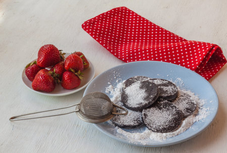 Homemade pasta on a plate of strawberries and strawberries nextの写真素材