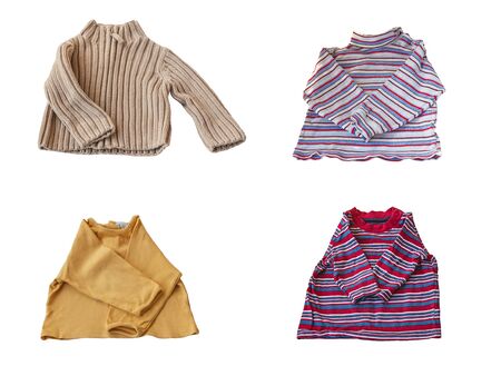 A set of four jumpers for a young child on a white background isolatedの写真素材